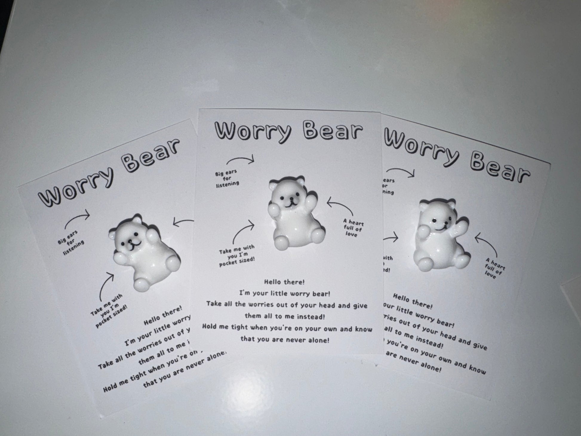 Worry bear toy with instructions on a white background